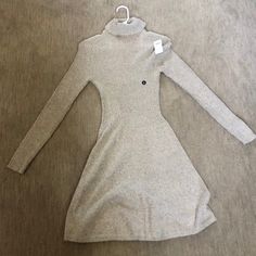 Turtleneck Dress That Is Tight At The Top And Flares Out A Bit At The Bottom. Midi Dress With Long Sleeves. Color Is Tan/Beige. Size Medium. Never Worn With Tags Long Sleeve Satin Dress, Green Wrap Dress, Bodycon Sweater Dress, Striped Sweater Dress, Flannel Dress, Turtleneck Dress, Corset Mini Dress, White Polka Dot Dress, Casual Long Sleeve Shirts