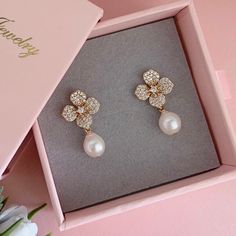 * DETAILS * - High Quality CZ Paved Flower Ear Post Gold Plated Brass Earrings  - Freshwater Baroque Pearls 7-8mm 👉🏻For more earrings, see https://www.etsy.com/shop/JinnysJewelryBySeJin 🎁 These earrings come in a special designer pouch enclosed in a cardboard box. A designer pull drawer pink gift box is available when the gift wrapping option is chosen. 👉🏻Please note that all Jinny's Jewelry pieces are crafted by hand and one-of-a-kind, and may therefore vary slightly in size and shape. --- Elegant Crystal Flower Shape Earrings For Party, Elegant Flower Shaped Crystal Earrings For Formal Occasions, Elegant Formal Crystal Flower Earrings, Elegant Formal Flower Crystal Earrings, Elegant Formal Flower-shaped Crystal Earrings, Party Pearl Drop Earrings With Flower Shape, Pearl Drop Flower-shaped Earrings For Party, Elegant Formal Earrings With Flower Decoration, Flower Shaped Pearl Earrings For Parties