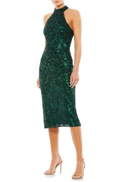 The most festive of frocks is rendered in a verdant hue, gridded with sequins and styled to show off your shoulders with alluring aplomb. 46" length Halter neck Sleeveless, with cutaway shoulders Lined 100% polyester Spot clean Imported Vestidos Color Coral, Mac Duggal Dress, After Prom, Halter Cocktail Dress, Sparkle Skirt, Cocktail Dress Prom, Mac Duggal Dresses, Beaded Cocktail Dress, Semi Formal Dress