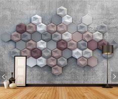 an empty room with wooden flooring and wallpaper on the walls is decorated with hexagonal shapes