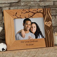 a personalized wooden frame with a couple holding each other