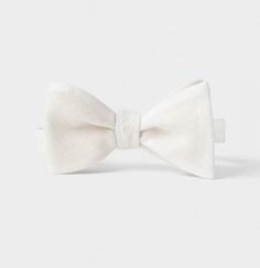 Elegant Summer Bow For Gifts, White Standard Bow Tie, Elegant Spring Bow Tie With Butterfly Knot, White Adjustable Bow Tie Back, Adjustable White Bow Tie Back, Dapper Satin Bow Tie For Summer, Dapper Summer Bow Tie With Satin Bow, Elegant Summer Bow With Butterfly Knot, Summer Black Tie Bow Tie With Satin Bow