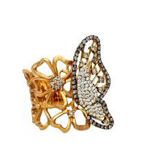 This gorgeous Butterfly ring is perfect to wear to that special event. There are fancy champagne, black and white brilliant cut diamonds all over the butterfly design for a beatiful accent. The band has rows of flowers in 18K Rose Gold. This ring has detailed original tags and will be shipped in a beautiful box, ready for the perfect gift! Ring size: 6.5 US 18K Rose weight: 15.35 grams Fancy Colored Diamond: 71 round 0.83 cts White Diamonds: 60 brilliant cut round, 0.32 cts Usually ships within Luxury White Diamond Ring For Party, Luxury Butterfly Ring For Formal Occasions, Luxury Butterfly Ring With Brilliant Cut - Gift, Luxury Butterfly Ring With Brilliant Cut For Gift, Luxury Butterfly Ring With Brilliant Cut, Butterfly Shaped Diamond Ring Fine Jewelry, Luxury Butterfly Ring With Brilliant Cut For Wedding, Butterfly Shaped Diamond Ring In Fine Jewelry Style, Luxury Diamond Butterfly Ring