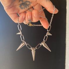 I made this spikey necklace for myself from leftover pieces to the wall hanging collection, and decided to make a few more with whats left. Materials: Stainless steel Length options: 16" or 18" *I'm wearing a 16" length in the second photo. The Mini Spikey Necklaces have only small spikes and come with a 15" chain and toggle clasp. They are limited and ready to ship. Punk Gold Stainless Steel Jewelry, Gold Punk Jewelry With Adjustable Chain, Trendy Metal Charm Necklaces For Everyday, Punk Style Gold Jewelry With Adjustable Chain, Gold Charm Necklaces For Everyday, Trendy Silver Round Charm Necklaces, Nickel Free Stainless Steel Punk Necklace, Trendy Nickel-free Sterling Silver Charm Necklaces, Trendy Metal Necklaces For Everyday