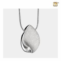 The TearDrop Pendant with rhodium plating is both beautiful and exquisite, as well as well-made and durable. The pendant itself is styled after a teardrop, but the features enhance it to give it a touch of class and refinement. The surface of the teardrop has been given a textured coating, which pairs with the striking crystal detail at the bottom of the pendant. The teardrop is made from sterling silver 925 but has been coated in rhodium plating. It is durable, resists corrosion and scratches, Teardrop Jewelry, Cremation Jewelry, Small Containers, Teardrop Pendant, Drop Pendant, Shiny Silver, Crystal Pendant, Sterling Silver Pendants, Silver 925