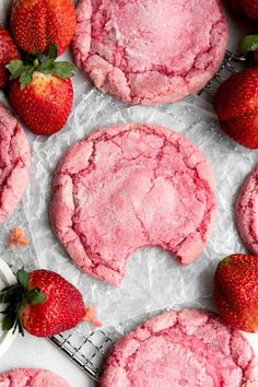 strawberry shortbread cookies with powdered sugar and fresh strawberries on the side, ready to be eaten