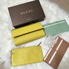 Yellow Wallet From Gucci Made Of Smooth Leather With Embossed 'Gg Original' Pattern. Snap Fastening. Interior With 1 Pocket And 3 Removable Pouches: Yellow Zip Pouch For Coins, Brown Pouch With A Compartment And 16 Card Slots Green Pouch With 2 Compartments And 5 Card Slots. Leather Wrist Strap. 100% Leather Width: 11cm Length: 21,5cm Condition: New In Box Unisex Gucci Travel Wallets With Card Slots, Gucci Wallets With Card Slots For Travel, Rectangular Gucci Wallet For Travel, Classic Gucci Wallet For Travel, Classic Gucci Travel Wallet, Designer Green Wallet As Gift, Designer Green Wallets For Gift, Designer Green Wallets As Gift, Luxury Gucci Wallets With Interior Card Slots