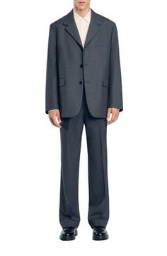 Oversized suit jacket with long sleeves, button fastening and flap pockets. Sandro Men's suit jacket Oversized fit Long sleeves Button fastening 2 flap pockets Slanted chest pocket The model is 6'1 tall and wears a size 48 Professional Long Sleeve Suits With Pockets, Professional Single-breasted Outerwear For Business Meetings, Tailored Suits With Pockets For Office Wear, Formal Outerwear With Pockets And Straight Hem, Professional Blazer With Pockets, Professional Suits With Pockets For Formal Occasions, Professional Formal Suits With Pockets, Wool Suits For Office, Tailored Professional Blazer With Pockets