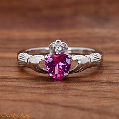 Solid 925 Sterling Silver October Birthstone Rose Pink Color Heart CZ Celtic Traditional Claddagh Ring Girls Childrens Womens Size 4-12 ▷Gift Box Included ▷9mm Height ▷Size 4 - 12 Available ▷925 Sterling Silver (not plated or filled) ▷925 Stamp Authenticity ▷High-Quality Cubic Zirconia Used https://www.etsy.com/shop/TrendyRing Rose Pink Color, Claddagh Ring, Color Heart, Claddagh Rings, October Birthstone, Personalized Rings, Dream Jewelry, Colorful Heart, October Birth Stone