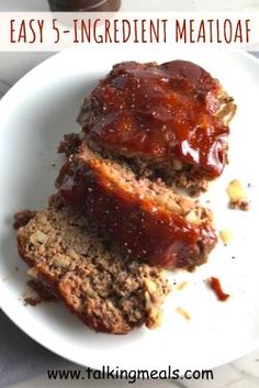 two meatloafs on a plate with ketchup