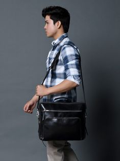 a young man carrying a black leather briefcase