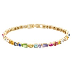 PRICES MAY VARY. Stunning Design - This bracelet features mixed-shape, rainbow gems bound together in an eternity bracelet design, topped off with a super vibrant matching enamel for a pop of color in every outfit. Features a foldover clasp closure. Vibrant and Colorful Accessory - Our Kayden Bracelet's super vibrant, rainbow color palette ensures a pop of color with any outfit. t's the perfect, dainty addition to your stackable bracelet collection, or can be worn as a statement piece on its own Trendy Gifts For Women 2024, Colorful Bracelet Stack, Gold Bracelet Stack, Rainbow Color Palette, Gold Bracelets Stacked, Eternity Bracelet, Xmas 2024, Dream Bracelet