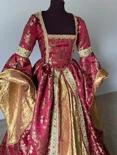 Red Floor-length Gown For Costume Party, Red Ball Gown For Costume Party, Red Fitted Gown For Costume Party, Red Floor-length Dress For Costume Party, Elegant Red Gown For Fancy Dress, Red Floor-length Gown For Costume, Red Floor-length Gown For Costume Occasions, Red Floor-length Costume Gown, Fitted Baroque Party Dresses