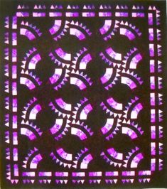 a purple stained glass window with geometric designs