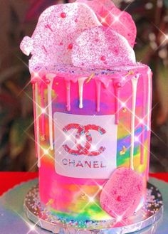 a chanel cake with pink icing and sprinkles