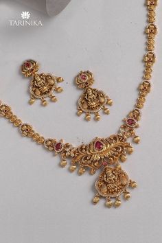 Make a statement with timeless temple jewelry from the house of Tarinika. Avail 10% off upon using code NEW10. Elegant Chandbali Bridal Sets For Puja, Elegant Bridal Sets For Puja Festivals, Festive Temple Jewelry Sets For Celebration, Festive Celebration Temple Jewelry Sets, Elegant Zari Work Jewelry For Puja, Temple Jewelry Sets With Intricate Design For Diwali, Elegant Sets With Tilla For Puja, Festive Gold Plated Temple Jewelry Sets, Festive Jewelry Sets With Zari Work For Festivals