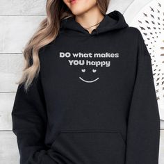 SIZES ARE TRUE FIT, ORDER A SIZE OR TWO BIGGER FOR LOOSE FIT. Especially if you're going for that trendy oversized look. Introducing the "Do What Makes You Happy" Embroidered Hoodie: A Daily Reminder to Follow Your Joy Elevate your everyday wardrobe with our "Do What Makes You Happy" embroidered hoodie. This stylish and cozy hoodie carries a simple yet powerful message, encouraging you to prioritize your happiness and embrace the things that bring you joy. Whether you're relaxing at home or out Black Hooded Sweatshirt As Gift, Funny Hooded Sweatshirt For Winter, Black Hooded Sweatshirt Gift, Funny Winter Hooded Sweatshirt, Black Casual Hoodie As Gift, Casual Black Hoodie As Gift, Winter Funny Graphic Print Hoodie, Funny Hooded Sweatshirt With Letter Print, Funny Winter Hoodie With Graphic Print