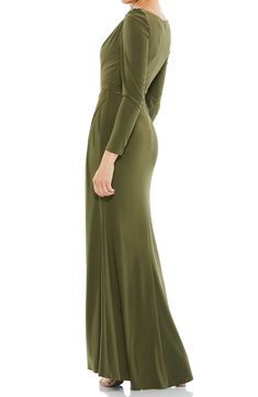 Subtle gathering at the hip and shoulder flatter your figure in an elegant long-sleeve gown finished with twinkling crystals at the shoulder. 63" length Bateau neck Long sleeves Lined 100% polyester Spot clean Imported Long Sleeve Ruched Evening Dress For Formal Occasions, Formal Long Sleeve Ruched Evening Dress, Long Sleeve Ruched Evening Dress For Gala, Ruched Long Sleeve Evening Dress For Gala, Long Sleeve Ruched Evening Dress, Ruched Long Sleeve Gown For Gala, Ruched Long Sleeve Maxi Dress With Fitted Bodice, Fitted Bodice Long Sleeve Dinner Gown, Dinner Gown With Fitted Bodice And Long Sleeves