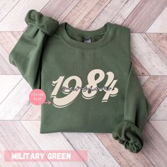 Get ready to love this 40th Birthday Sweatshirt, is the perfect Vintage 1984 Sweatshirt It will make the best gift for any 40th Birthday Gift For Women who loves colorful vibes with 40th Birthday Friend, 40th Birthday Woman. Welcome to FocusUS! Size & Colors; For size and color options, please look at listing images. Gildan Brand, 50% cotton, medium weight and soft touch. Usually runs true size. DTF printing method is used for these sweatshirts. How to order 𝟏. Please, check and review listing 40th Birthday Gift For Women, 1984 Birthday, 40th Birthday For Women, Colorful Vibes, Year Sweatshirt, 40th Birthday Gifts For Women, Birthday Friend, Birthday Sweatshirt, Birthday Gift For Women