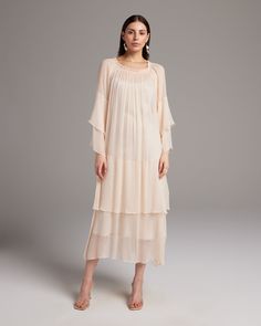 This effortless silk chiffon dress features a romantic double layer cascade in the bodice and sleeve, and a stretch oval neckline that can be worn over the shoulder. Wear it loose as a whimsical party dress, or belt it for a sleek cocktail look. Handmade in New York. 100% silk chiffon Model is wearing a size S and is 5'10" Product Care: Dry Clean Only Shown with the Midi Slipdress Cream Chiffon Dress, Evening Dresses With Pleated Sleeves And Pre-draped Style, Spring Silk Dress With Pre-draped Style, Spring Pre-draped Chiffon Dress, Spring Pre-draped Flowy Dress, Pre-draped Silk Chiffon Maxi Dress For Spring, Cocktail Dress With Straight Neckline And Pre-draped Style, Flowy Pre-draped Party Dress, Chic Maxi Dress With Straight Neckline And Ruffles