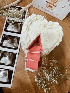 a heart shaped cake sitting on top of a table next to an x - ray