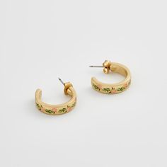 Elevate your style with these charming gold hoops adorned with hand-painted enamel delicate pink flowers. These earrings celebrate the fleeting beauty of spring, a perpetual bloom captured in a timeless design. Key features: Hand-painted enamel Hand-carved detailing 18K Worn-gold plated zinc alloy, enamel 5mm width band; 2mm thick-rounded; 16mm internal diameter Comes in a gift box with cotton pouch Spring Hand Painted Jewelry, Hand Painted Jewelry For Spring, Irish Knit Sweaters, Tweed Purse, Wrendale Designs, Irish Cottage, Heart Pocket, Cotton Pouch, Tartan Scarf