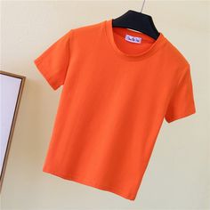 Basic Summer T-shirt, Casual Green Solid Color T-shirt, Basic Green Solid Color T-shirt, Basic Stretch Solid Color T-shirt, Basic Stretch T-shirt In Solid Color, Sporty Solid Color Crew Neck Top, Spring Stretch Plain T-shirt, Spring Stretch T-shirt, Basic Orange Crew Neck T-shirt