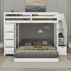 a white bunk bed with drawers underneath it