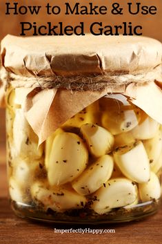 pickled garlic in a jar with text overlay how to make and use pickled garlic