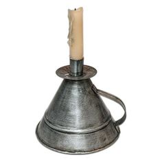 a candle holder with a metal cone on it