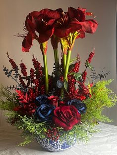 A vibrant floral centerpiece that is sure to add color and beauty to any space. Dining room, great room, office, business, waiting room, medical office, or event. These stunning red and navy rose are nestled with its greenery and tall amaryllis standing in this beautiful decorative accent vase. Bring that happiness to your home or special space all year round. Artificial Floral Centerpieces, Tall Floral Arrangements, Rose Floral Arrangements, Unique Flower Arrangements, Artificial Floral Arrangements, Faux Hydrangea, Elegant Vases, French Flowers, Silk Flower Arrangements