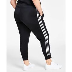 Keep active in these fitted Women's Essentials Warm-Up Slim Tapered 3-Stripes Track Pants from adidas, designed for zero distractions with a close, tapered fit that stays securely in place. The elastic waist features a convenient drawcord to customize coverage and comfort, while front pockets stash music players or cash. Breathable polyester fabrication keeps you cool whether climbing stairs or dropping low into squats, with flatlock seams preventing chafing. Subtle 3-Stripes branding adds style Adidas Sweatpants With Three Stripes For Workout, Adidas Workout Joggers With Three Stripes, Adidas Joggers With Three Stripes For Workout, Athleisure Sweatpants With Three Stripes For Gym, Adidas Three Stripes Joggers For Workout, Sportswear Joggers With Three Stripes For Workout, Adidas Casual Joggers With Side Stripes, Stretch Sweatpants With Side Stripes For Jogging, Adidas Moisture-wicking Sweatpants For Jogging