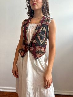 Vintage tapestry waistcoat / vest / Roughrider / Aztec pattern / Western / Bohemian  ꩜Label: Roughrider, made in USA ꩜Condition: great vintage condition, gently worn.  ꩜Material: 100% cotton ꩜Sizing: Fits up to small.  Please check measurements provided below. Waist laid flat 38 cm Length 42 cm Pit to pit 50 cm Arm hole 27.5 cm All measurements taken with garment laid flat ꩜All garments shown on a 165 cm tall model who wears size 8 AU bottom and XS top, 66 cm waist. SHOP POLICIES Please make sur Gr 86, Vest Layering, Western Bohemian, Western Vest, Boho Vest, Vintage Tapestry, Western Boho, Aztec Pattern, Vest Outfits