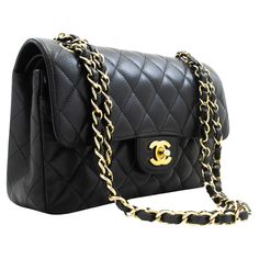 An authentic CHANEL Grained Calfskin Double Flap 9" Chain Shoulder Bag Black. The color is Black. The outside material is Leather. The pattern is Solid. This item is Contemporary. The year of manufacture would be 2017. Conditions & Ratings Outside material: Lambskin Color: Black Closure: Turn Lock Hardware and chain: Gold-Tone Made in France Serial sticker: Attached Comes with: Dust bag, Box, Care booklet Overall: 8 of 10 - The outside is in excellent condition with minimal signs of use only. NO Black Chanel Bag, Vintage Chanel Bag, Chanel Suit, Structured Shoulder, Chanel Brand, Sunglasses Logo, Black Clutch, Double Chain, Shoulder Bag Black