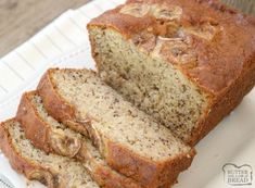 a loaf of banana bread sitting on top of a cutting board