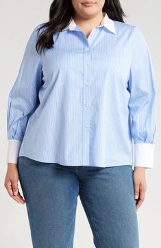 Caris Shirt is a slightly cropped cotton shirt. Button down with contrast white collar and barrel cuffs. Relaxed fit. Material: 100% Cotton. Model 1 wears size 'S'. Model 2 wears size '1X'.