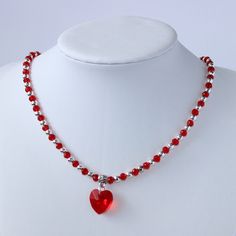 Handmade heart bright red glass bead and silver plated seed bead necklace. This dainty statement necklace is understated gorgeous, something truly lovely you could wear everyday to add a little extra sparkle to your day.  The faceted glass heart catches the light to add that lovely sparkle this necklace will add to any outfit.  Made with  ⭐ 4mm faceted glass rondelle bright red beads ⭐ 4mm silver plated seed beads  ⭐ 14mm faceted bright red heart ⭐ Tibetan silver plated flower patterned pendant Cheap Red Beaded Necklace With Heart Beads, Red Handmade Necklace, Party Beaded Necklace With Heart Pendant, Party Heart Pendant Beaded Necklace, Valentine's Day Beaded Party Necklace, Party Beaded Necklaces With Heart Pendant, Heart Pendant Beaded Necklace For Parties, Party Necklaces With Heart And Round Beads, Heart Beaded Necklaces For Valentine's Day Party