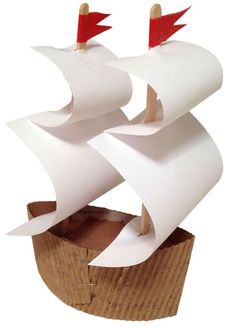 a paper boat with two red flags on it