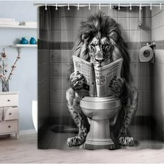 a lion sitting on top of a toilet reading a newspaper in a bathroom shower curtain