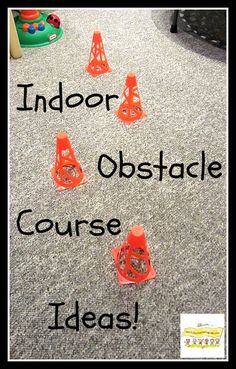 an indoor obstacle course with orange cones on the floor