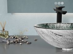 a bowl sink sitting on top of a counter