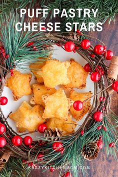 puff pastry cheese stars on a white plate surrounded by pine cones and red berries with text overlay