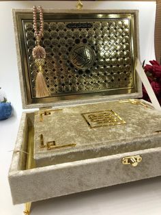 an open jewelry box sitting on top of a table