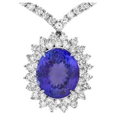 22.80Ct Natural Tanzanite and Diamond 18K Solid White Gold Necklace Total Natural Oval Tanzanite Weight is: Approx. 11.90 Carats Tanzanite Measures: Approx. 15 x 13 mm Total Natural Diamond Weight is Approx. 10.90Ct (color G-H / Clarity SI1-SI2) Necklace Length is 18 inches Total item weight is: Approx. 25 grams Disclaimer: all weights, measurements and colors are approximate and may vary slightly from the listed dimensions or as seen in the image. All pictures are magnified to show the smallest Gold Movie, Solid Necklace, White Gold Necklace, Tanzanite Diamond, White Gold Necklaces, Natural Tanzanite, Drop Necklace, Quality Diamonds, Wedding Necklace