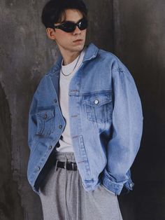 This basic denim jacket is modelled on classic trucker style featuring dual flap pockets and silver-tone metal buttons. Light-wash blue color easily incorporated into any wardrobe and oversized fit allows comfortable layering.- Collared neck- Button fastenings- Double chest pockets- Two fromt welt pockets- Adjustable buttoned tabs at back hem- Oversized fit Blue Jeans Jacket Outfit Men, Oversized Denim Jacket Outfit Men, Jacket Jeans Outfit Men, Blue Denim Jacket Outfit Men, Light Denim Jacket Outfit, Light Blue Jacket Outfit, Blue Jacket Outfits Men, Blue Denim Jacket Outfit, Blue Jean Jacket Outfits