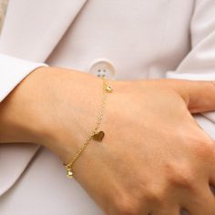 14K Gold-Plated Silver Bracelet with Elegant Heart Charms - A Timeless Expression of Love. 💖 Celebrate Love with Every Wrist Flick 💖 Introducing our exquisite 14K gold-plated silver bracelet, adorned with delicate heart charms. This bracelet isn't just an accessory; it's a symbol of love, affection, and the timeless bonds we share. Why You'll Adore This Bracelet: Elegant Heart Charms: Each heart charm is a reminder of love's enduring presence in our lives. Luxurious Craftsmanship: Crafted from Adjustable Silver Heart Bracelet Gold Plated, Name Bracelet With Heart Charm For Gift, Adjustable Tarnish-resistant Heart Bracelet Gift, Minimalist Metal Heart Bracelet As Gift, Minimalist Metal Heart Bracelet Gift, Mother's Day Gift Charm Bracelet With Heart Charm, Mother's Day Anniversary Charm Bracelet With Heart Charm, Mother's Day Anniversary Heart Charm Bracelet, Heart Bracelet With Extender As Gift