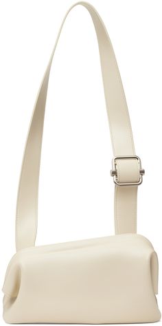 Buffed leather shoulder bag in off-white. · Adjustable crossbody strap · Logo stamp at back face · Hinged closure · Patch pocket at interior · Cotton canvas lining · Logo-engraved silver-tone hardware · H6 x W10.5 x D3.5 Supplier color: Cream Classic Formal Bag With Logo Strap, Classic Formal Shoulder Bag With Logo Strap, Elegant Formal Shoulder Bag With Logo Strap, Classic Leather Shoulder Bag With Logo Strap, White Business Shoulder Bag With Adjustable Strap, White Shoulder Bag With Detachable Strap For Business, White Shoulder Bag With Adjustable Strap For Business, Business Bags With Silver-tone Hardware In White, White Satchel Shoulder Bag With Palladium Hardware