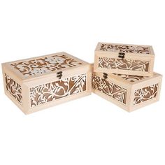 three wooden boxes with carved designs on them