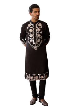 Black kurta with mirror embroidery along the placket and hem. Paired with a matching churidar. - Aza Fashions Black Embroidered Fabric For Designer Wear During Eid, Designer Black Kaftan With Resham Embroidery, Eid Embroidered Long Sleeve Fabric With Mirror Work, Eid Long Sleeve Embroidered Fabric With Mirror Work, Ceremonial Kurta With Intricate Embroidery For Navratri, Designer Embroidered Black Kaftan, Designer Black Embroidered Kaftan, Black Bollywood Kaftan With Zari Work, Designer Black Kaftan For Eid