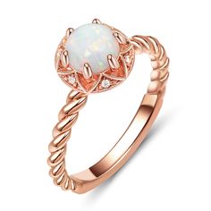 Embrace the beauty of this rose gold engagement ring, a testament to your enduring love story. Crafted in sterling silver, this stunning piece features a dazzling white opal as its centerpiece, radiating with a captivating brilliance. The intertwining design of the ring's band represents the unbreakable bond between two souls, forever entwined in a journey of love and commitment. Each twist and turn signifies the twists and turns of life, reminding us that love can weather any storm and emerge even stronger. With its delicate rose gold hue, this ring embodies elegance and sophistication, making it the perfect choice for a love that knows no bounds. The opulent white opal, with its ethereal charm, serves as a reminder of the enchanting moments shared and the dreams yet to be fulfilled.Carat Elegant White Opal Birthstone Ring, Elegant Opal Promise Ring, Elegant Opal Ring With Center Stone, Elegant Rose Gold Moonstone Promise Ring, Rose Gold Opal Ring In Fine Jewelry Style, Elegant Opal Rings With Halo Design, Rose Gold Opal Promise Ring, Fine Jewelry Opal Rings In Rose Gold, Fine Jewelry Rose Gold Opal Rings